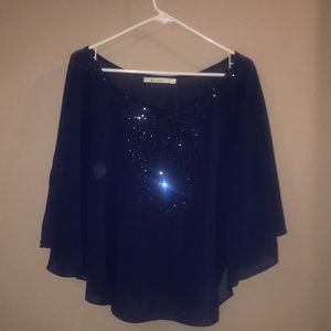 Blouse from Francesca’s, the brand is Miami